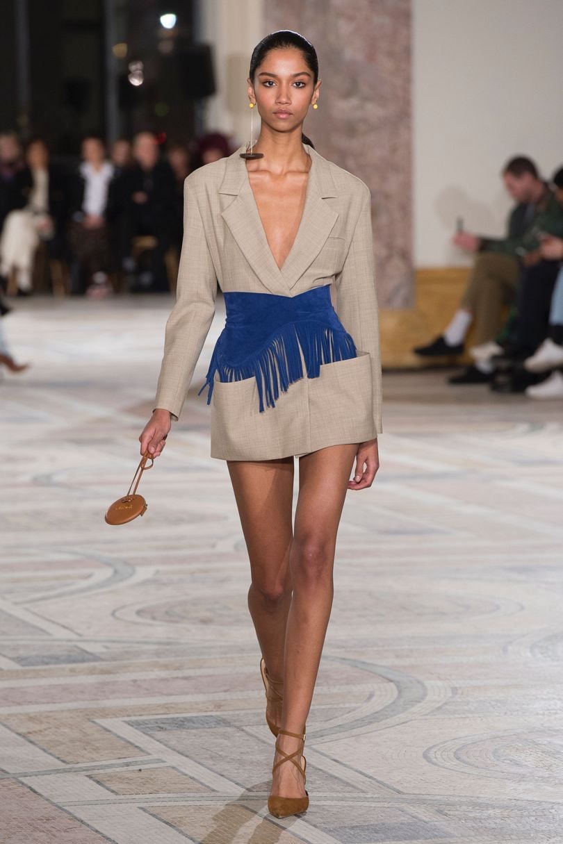 Woman wears a gray blazer dress for spring